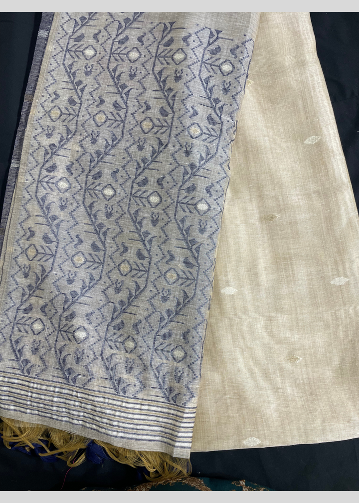 Off white and navy blue color soft muga cotton saree with jamdani woven design [SKU:S102942]