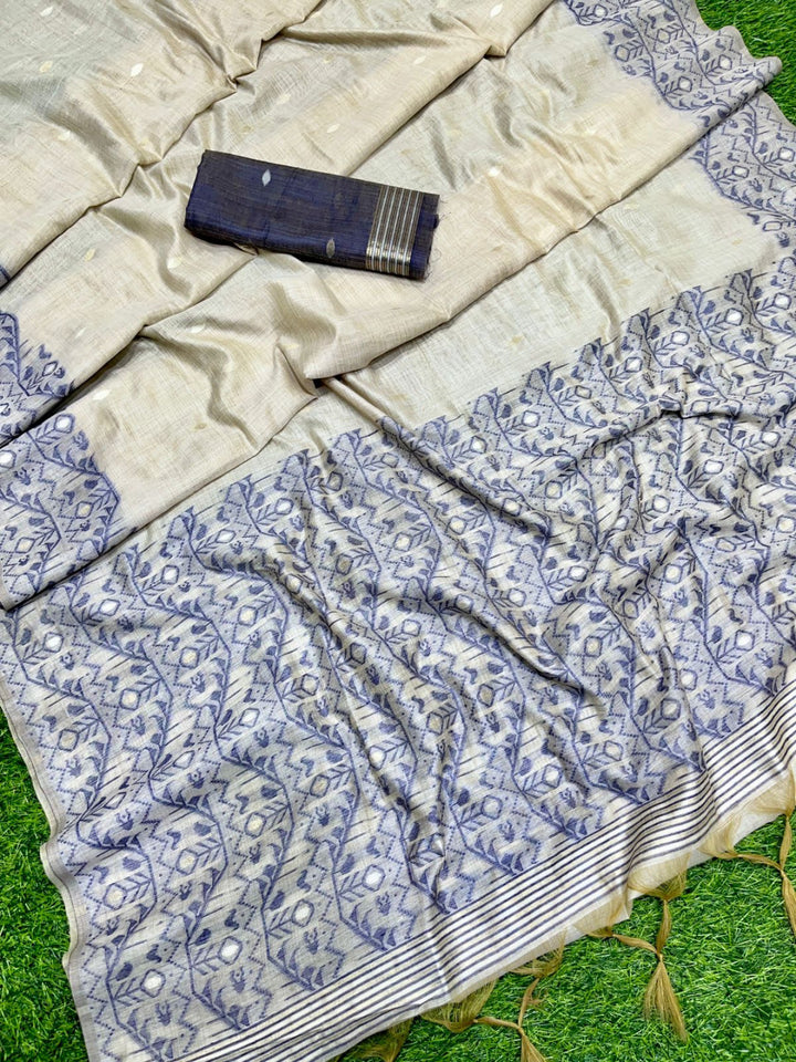 Off white and navy blue color soft muga cotton saree with jamdani woven design [SKU:S102942]